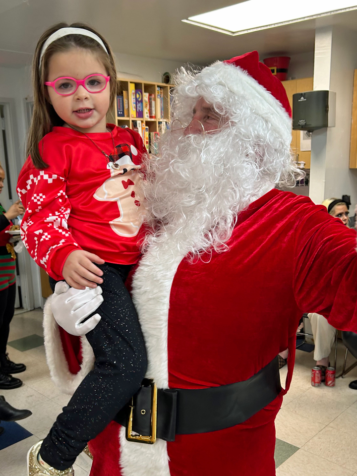 Young Mother's Program Santa and child